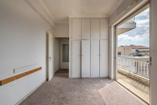 Existing interior before renovation: room with built-in wardrobes