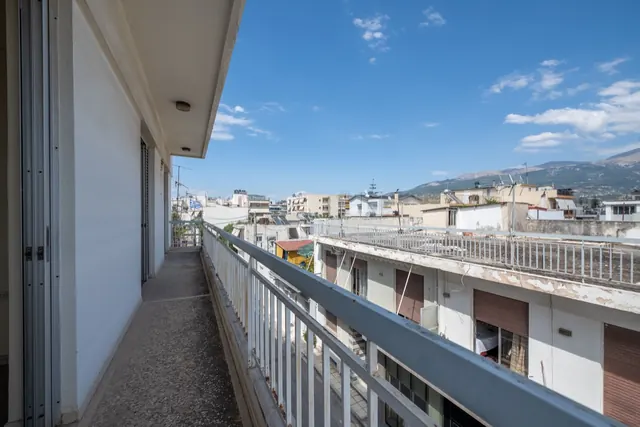 Existing wraparound balcony with a view over Patras