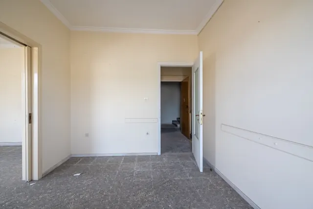 Existing interior before renovation: room and doorway